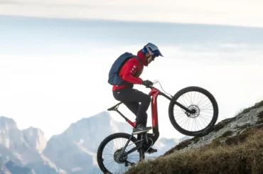 Rider tackling a steep mountain trail on a Haibike e bike, showcasing the power and performance of Haibike's advanced electric bike technology for off-road adventures