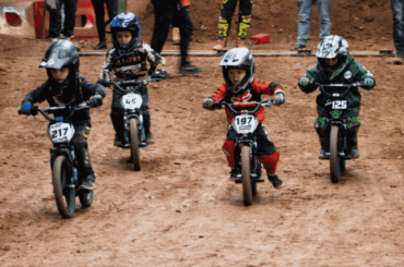 Kids riding Revvi electric balance bikes, enjoying the moment full of fun and exciting rides. The lightweight design and adjustable speed settings provide a safe and confidence-boosting experience for young riders.